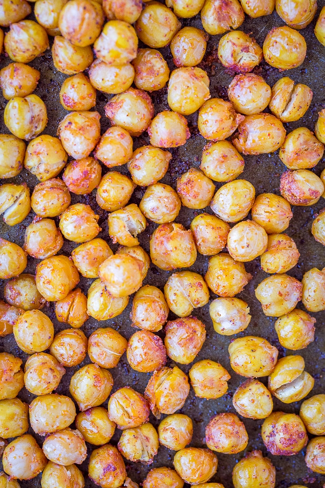 Crispy chickpeas on a baking sheet for hidden veggie pesto pasta recipe