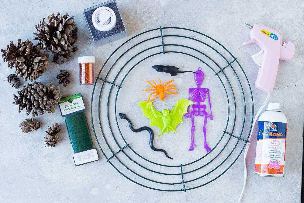 All the materials needed to make these Halloween Pinecone Wreaths