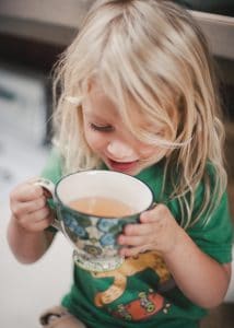 Boy drinking wild rose hip tea.