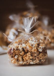 Christmas goodie bag filled with caramel corn.