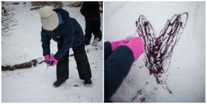 Child painting the snow.