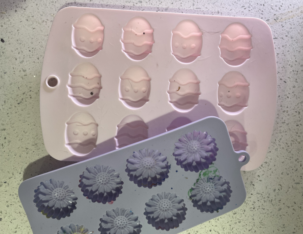 Silicone molds used to make crayon molds, a flower one and an Easter egg one